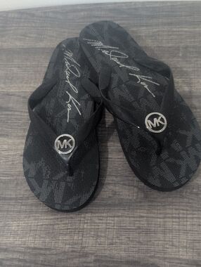 Michael Kors Black Flip Flops With Silver MK Logo